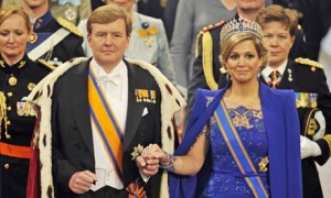 Dutch King Willem-Alexander and his wife Queen Maxima arrive at the Nieuwe Kerk church in Amsterdam